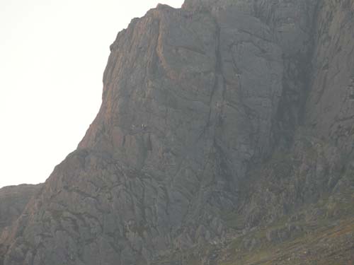 The trapped woman, centre, left of picture. Team at the top of the crag, lowering down.