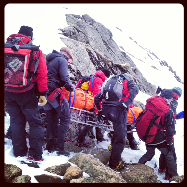 Stretcher carry over snowy ground