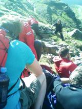Injured mountain biker - Waiting for helicopter to lift